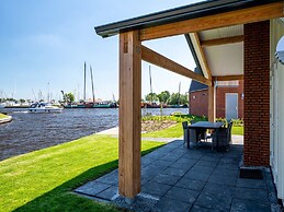 Bungalow With an Outdoor Fireplace by Water