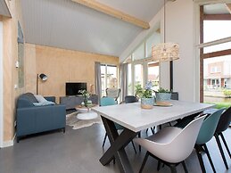 Bungalow With an Outdoor Fireplace by Water