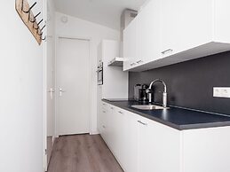 Bungalow With an Outdoor Fireplace by Water