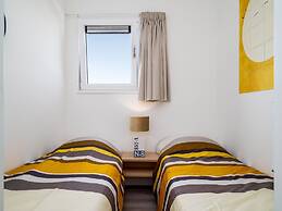 Bungalow With an Outdoor Fireplace by Water