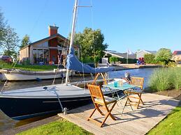 Bungalow With an Outdoor Fireplace by Water