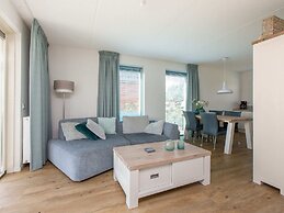 Bungalow With an Outdoor Fireplace by Water