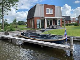 Bungalow With an Outdoor Fireplace by Water