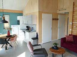 Bungalow With an Outdoor Fireplace by Water