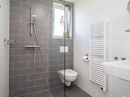 Bungalow With an Outdoor Fireplace by Water