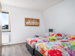 Bungalow With an Outdoor Fireplace by Water