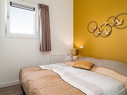 Bungalow With an Outdoor Fireplace by Water