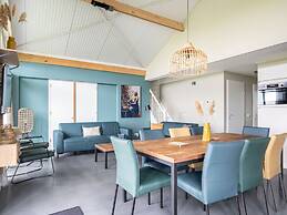 Bungalow With an Outdoor Fireplace by Water