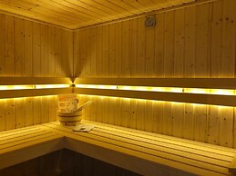 Bungalow With an Outdoor Fireplace by Water