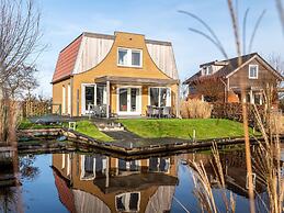 Bungalow With an Outdoor Fireplace by Water