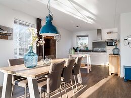 Bungalow With an Outdoor Fireplace by Water