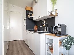 Bungalow With an Outdoor Fireplace by Water