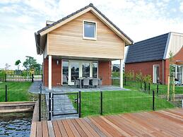 Bungalow With an Outdoor Fireplace by Water