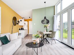 Bungalow With an Outdoor Fireplace by Water