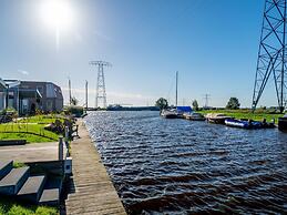Bungalow With an Outdoor Fireplace by Water