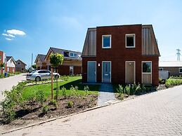 Bungalow With an Outdoor Fireplace by Water