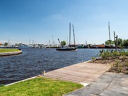 Bungalow With an Outdoor Fireplace by Water