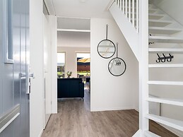 Bungalow With an Outdoor Fireplace by Water