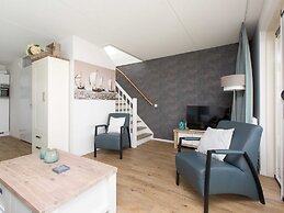 Bungalow With an Outdoor Fireplace by Water