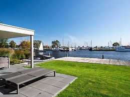 Bungalow With an Outdoor Fireplace by Water