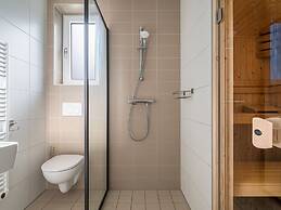 Bungalow With an Outdoor Fireplace by Water