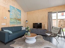 Bungalow With an Outdoor Fireplace by Water