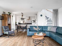 Bungalow With an Outdoor Fireplace by Water