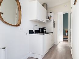 Bungalow With an Outdoor Fireplace by Water