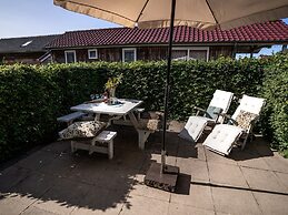 Bungalow With an Outdoor Fireplace by Water