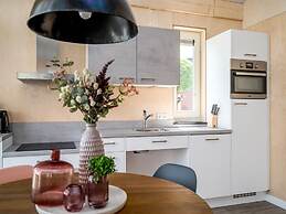 Bungalow With an Outdoor Fireplace by Water