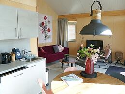 Bungalow With an Outdoor Fireplace by Water