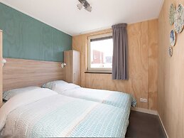 Bungalow With an Outdoor Fireplace by Water