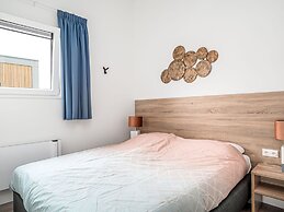 Bungalow With an Outdoor Fireplace by Water