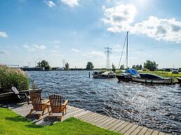 Bungalow With an Outdoor Fireplace by Water