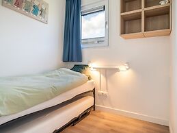 Bungalow With an Outdoor Fireplace by Water