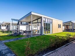 Bungalow With an Outdoor Fireplace by Water