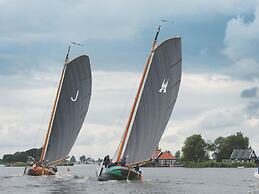 Bungalow With an Outdoor Fireplace by Water