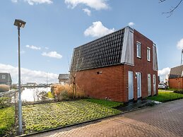 Bungalow With an Outdoor Fireplace by Water