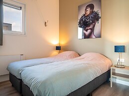 Bungalow With an Outdoor Fireplace by Water