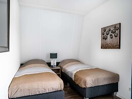 Bungalow With an Outdoor Fireplace by Water