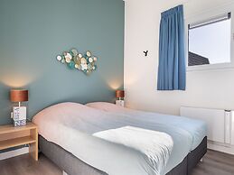 Bungalow With an Outdoor Fireplace by Water