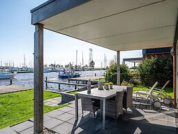 Bungalow With an Outdoor Fireplace by Water
