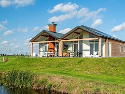 Bungalow With an Outdoor Fireplace by Water
