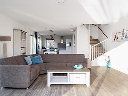 Bungalow With an Outdoor Fireplace by Water