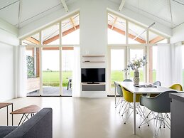 Bungalow With an Outdoor Fireplace by Water