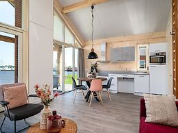 Bungalow With an Outdoor Fireplace by Water