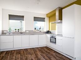 Bungalow With an Outdoor Fireplace by Water