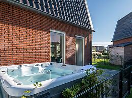 Bungalow With an Outdoor Fireplace by Water