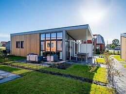 Bungalow With an Outdoor Fireplace by Water