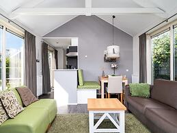 Bungalow With an Outdoor Fireplace by Water